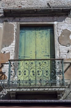 An old balcony door in Venice, Italy.