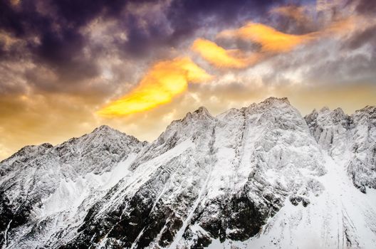 Winter mountains with dramatic colorful sky at sunset, High Tatras, Slovakia