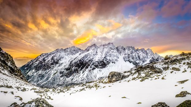 Panoramic view of white winter mountains after colorful sunset, High Tatras, Slovakia