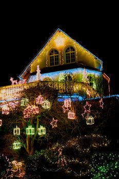 Colorful christmas lights on a family house
