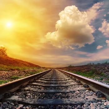 fantastic sunset over railroad to horizon