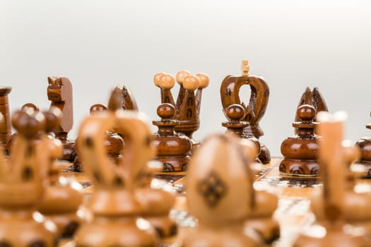 chess board focus to back king and queen on white background