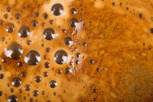 texture of freshly brewed coffee and milk with foam and bubbles