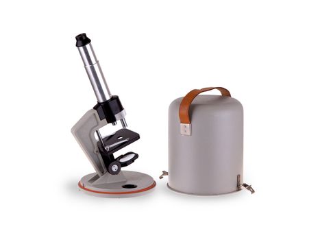 Old microscope isolated on a white background