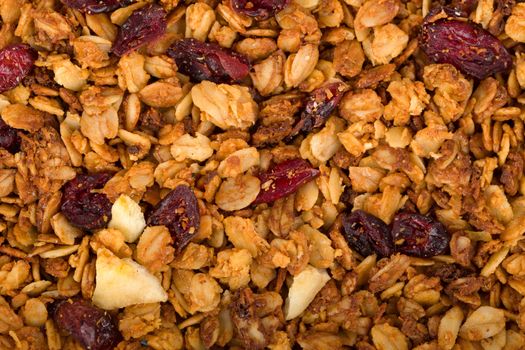 Healthy homemade granola or muesli with oats, dried raisin, almonds, hazelnuts and honey