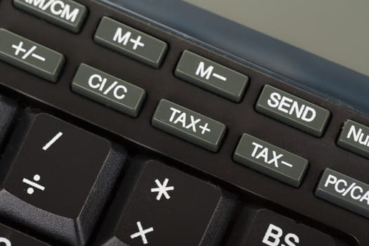 Keys of the calculator, close-up, stodio shot focus to key tax
