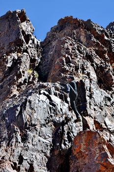 Young man climbing mountains