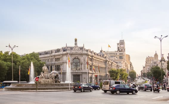 MADRID, SPAIN - SEPTEMBER 2, 2013: Historic Bank of Spain buiding and Cibeles square between Paseo del Prado and Alcala street in Madrid, Spain