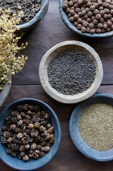 Herbs and spices in bowls used in ayurvedic medicine