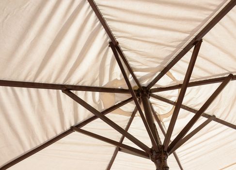 Off-white parasol seen from underneath