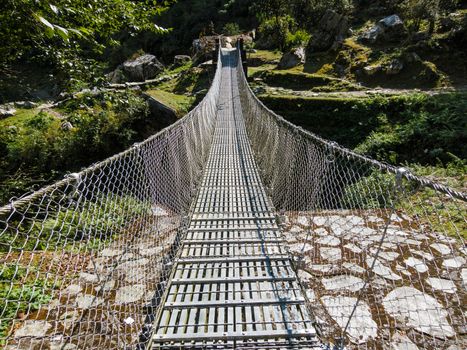 Suspension bridge over a river in Nepal