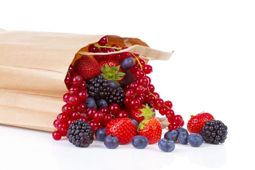 Bag with healthy fresh fruits over white background