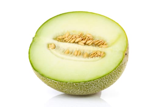 fresh yellow melon in half over white background