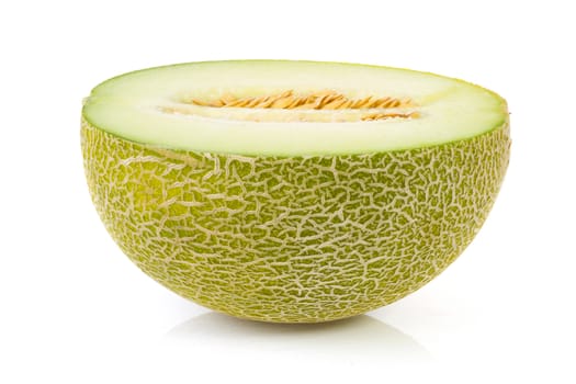 fresh yellow melon in half over white background