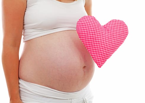 pregnant belly with checkered heart over white background