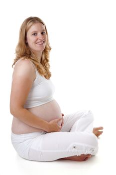 Studio portrait of pregnant woman over white background