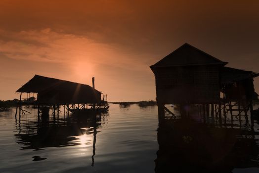 slilt houses in the evening at tonle sap lake in Cambodia