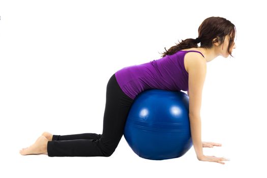 Young woman doing ball exercise for abs (Series with the same model available)