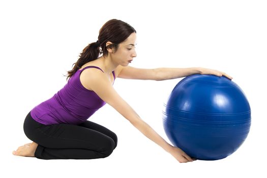 Woman doing exercises with a pilates ball (Series with the same model available) with a pilates ball (Series with the same model available)