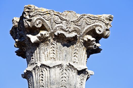 Old pillar close up at Volubilis in Morocco. Volubilis is a partly excavated Roman city in Morocco situated near Meknes between Fes and Rabat. It was developed from the 3rd century BC onwards as a Phoenician Carthaginian settlement