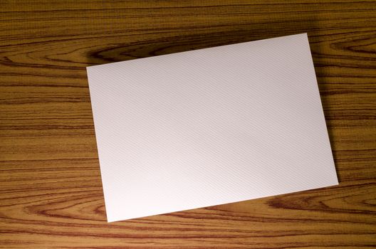 soft pink envelope on wooden background