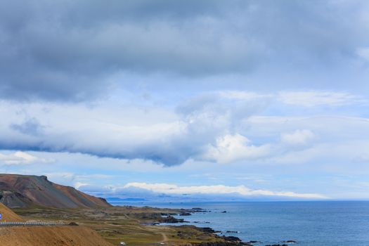 Cloudy sky over the coast in the East Fjords Iceland.