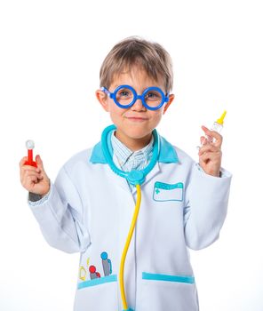 Portrait of a little smiling doctor with stethoscope and syringe. Isolated on white background