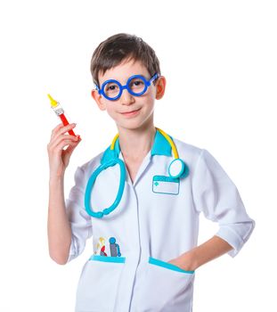 Portrait of a little smiling doctor with stethoscope and syringe. Isolated on white background