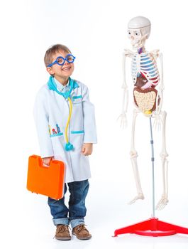 A little smiling doctor with stethoscope and skeleton. Isolated on white background