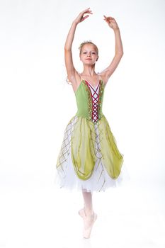 Beautiful young ballerina on a white background