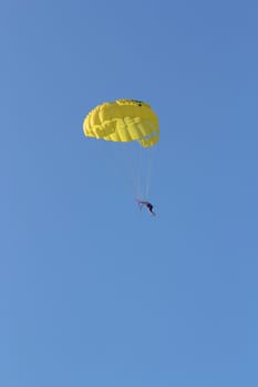 the skydiver flying in the open sky