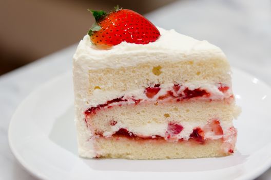 Strawberry Cake placed on a white plate.
