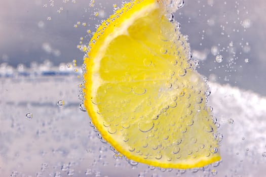 Glass citrus squeezer with lemons and juice