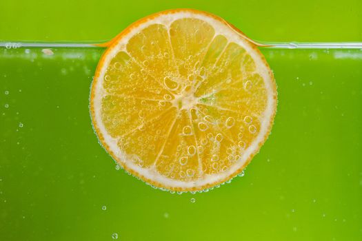 Glass citrus squeezer with lemons and juice