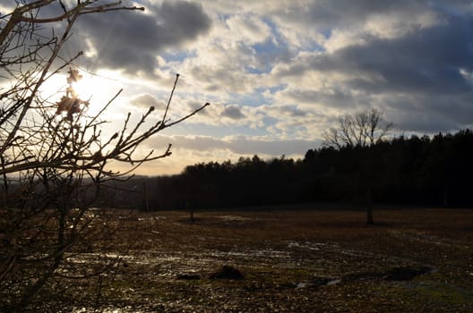 Winter time on a English farm. Wet ploughed fields under a moody sky.