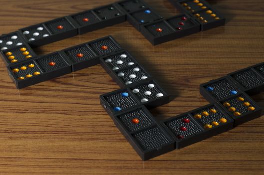 black domino on wooden background