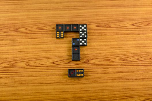 black domino on wooden background
