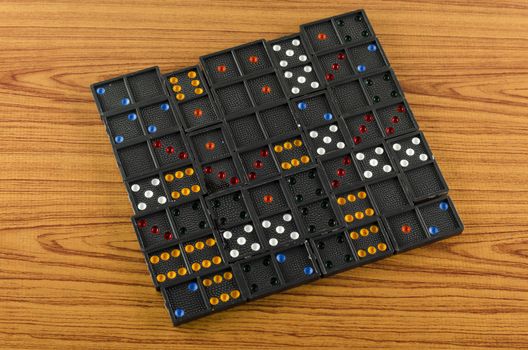 black domino on wooden background