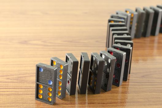 black domino on wooden background