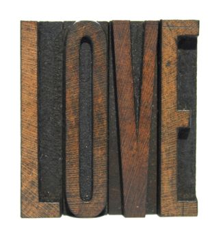 The word LOVE written in vintage letterpress type