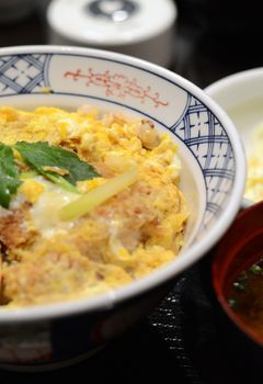 Japanese cuisine, Close up of Katsudon pork cutlet with fried egg on rice 