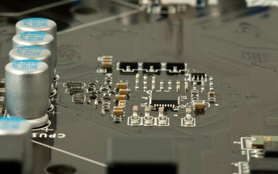 Laptop microchip and conductors on mother board closeup