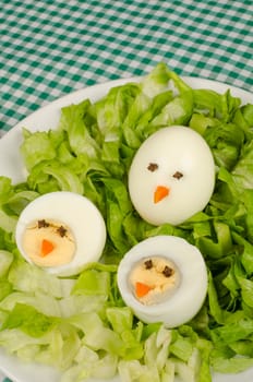 A salad decorated as a nest, funny kid food