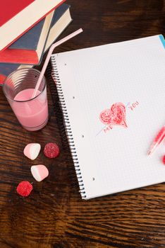 Romantic scribbling in a school notebook, a Valentines still life