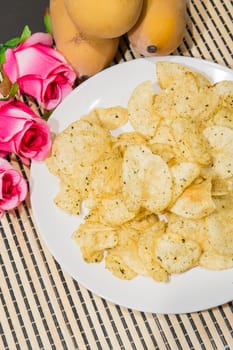 Fried potatoes, cut into pieces, mixed spices.