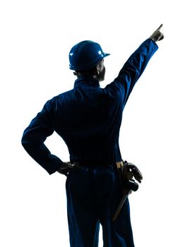 one caucasian man construction worker pointing showing silhouette portrait in studio on white background