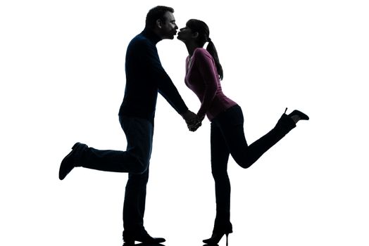 one caucasian couple woman man lovers kissing  in silhouette studio isolated on white background