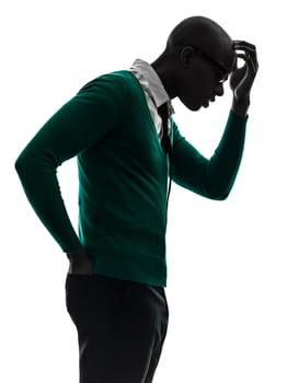 one african black man thinking pensive annoyed  in silhouette studio on white background