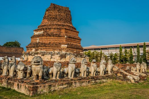chedi surrounded by lion statues in Wat Thammikarat temple at Ayutthaya bangkok thailand