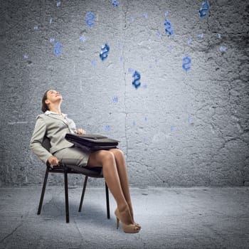 image of a young business woman looking at the falling business signs